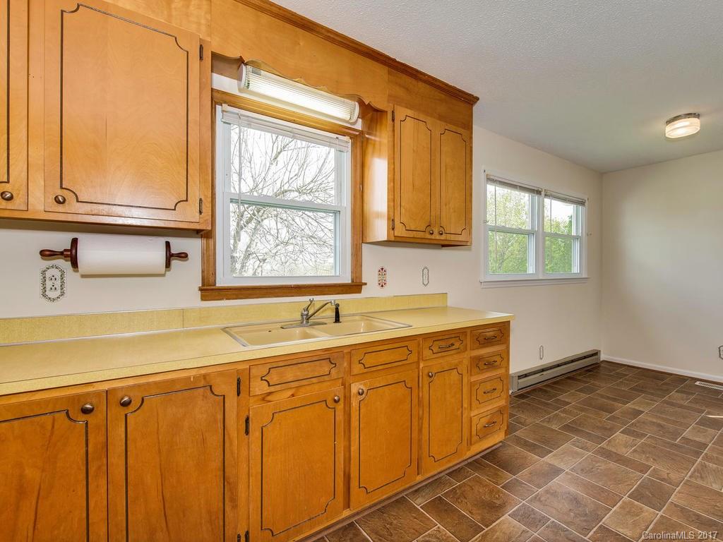 5117 Austin Road Monroe, NC 28112 - Photo 8 of 19 a bathroom with a sink window and a mirror
