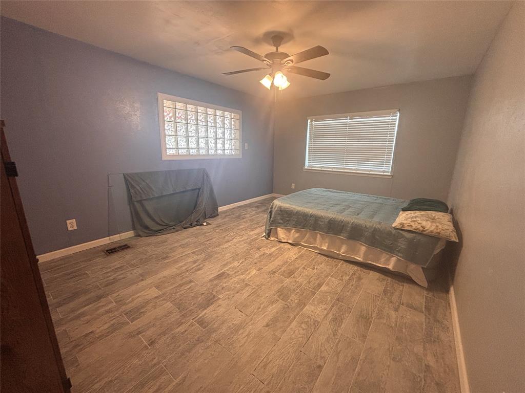 5355 Banks Road Fort Worth, TX 76140 - Photo 6 of 29 a bedroom with a bed and window