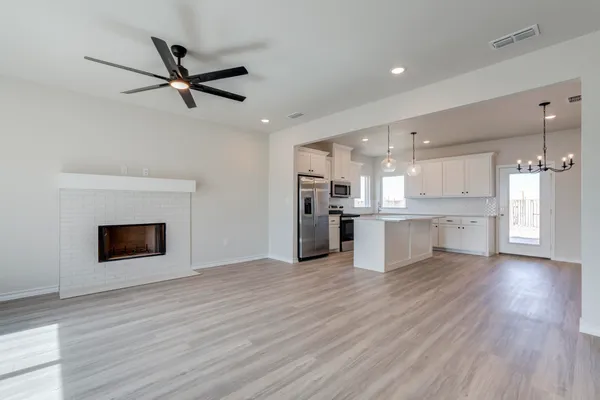 a view of a kitchen with a sink hardwood floor and a kitchen