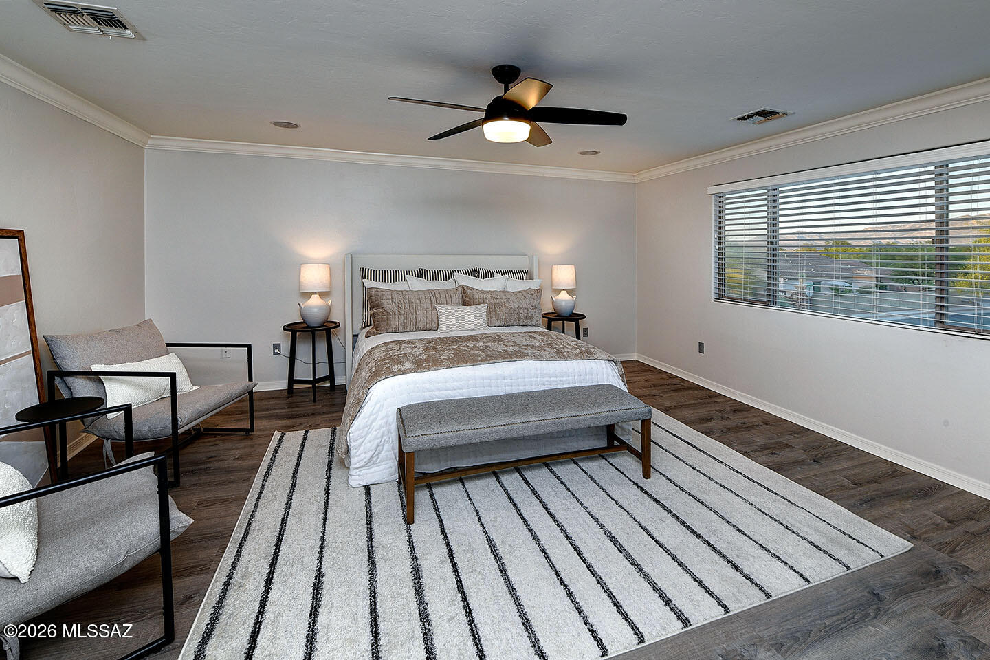 13464 North Piemonte Way Oro Valley, AZ 85755 - Photo 16 of 33 a bedroom with a bed and wooden floor
