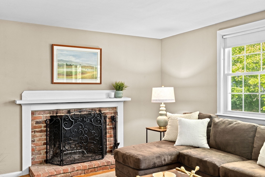 154 Mann Road Scituate, MA 02066 - Photo 12 of 34 a living room with furniture and a fireplace