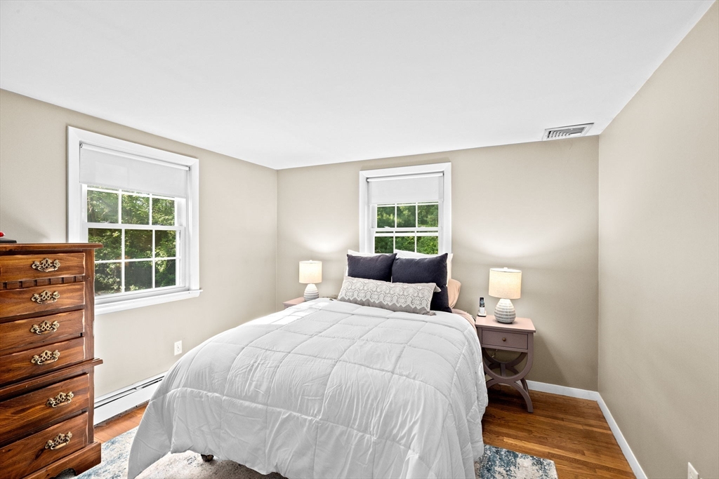 154 Mann Road Scituate, MA 02066 - Photo 15 of 34 a bedroom with a bed and a window