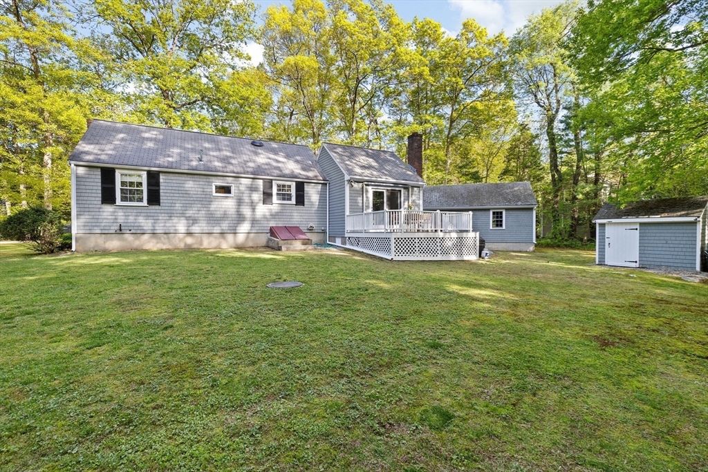 154 Mann Road Scituate, MA 02066 - Photo 27 of 34 a front view of a house with a garden and yard