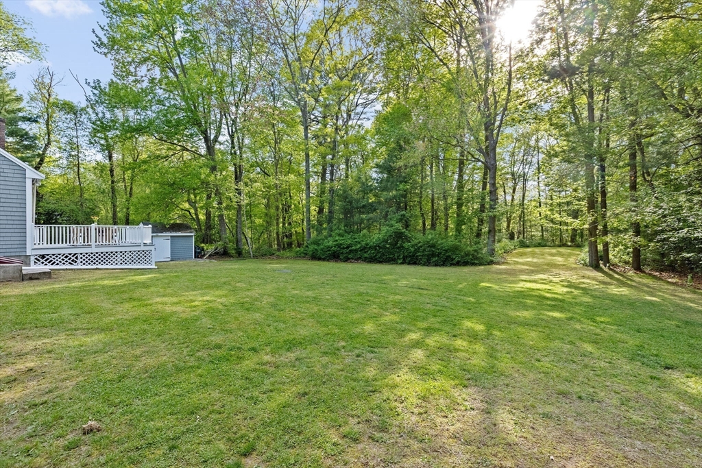 154 Mann Road Scituate, MA 02066 - Photo 29 of 34 a view of a backyard with a trees