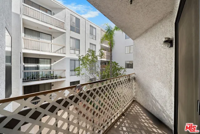 a view of balcony with wooden floor