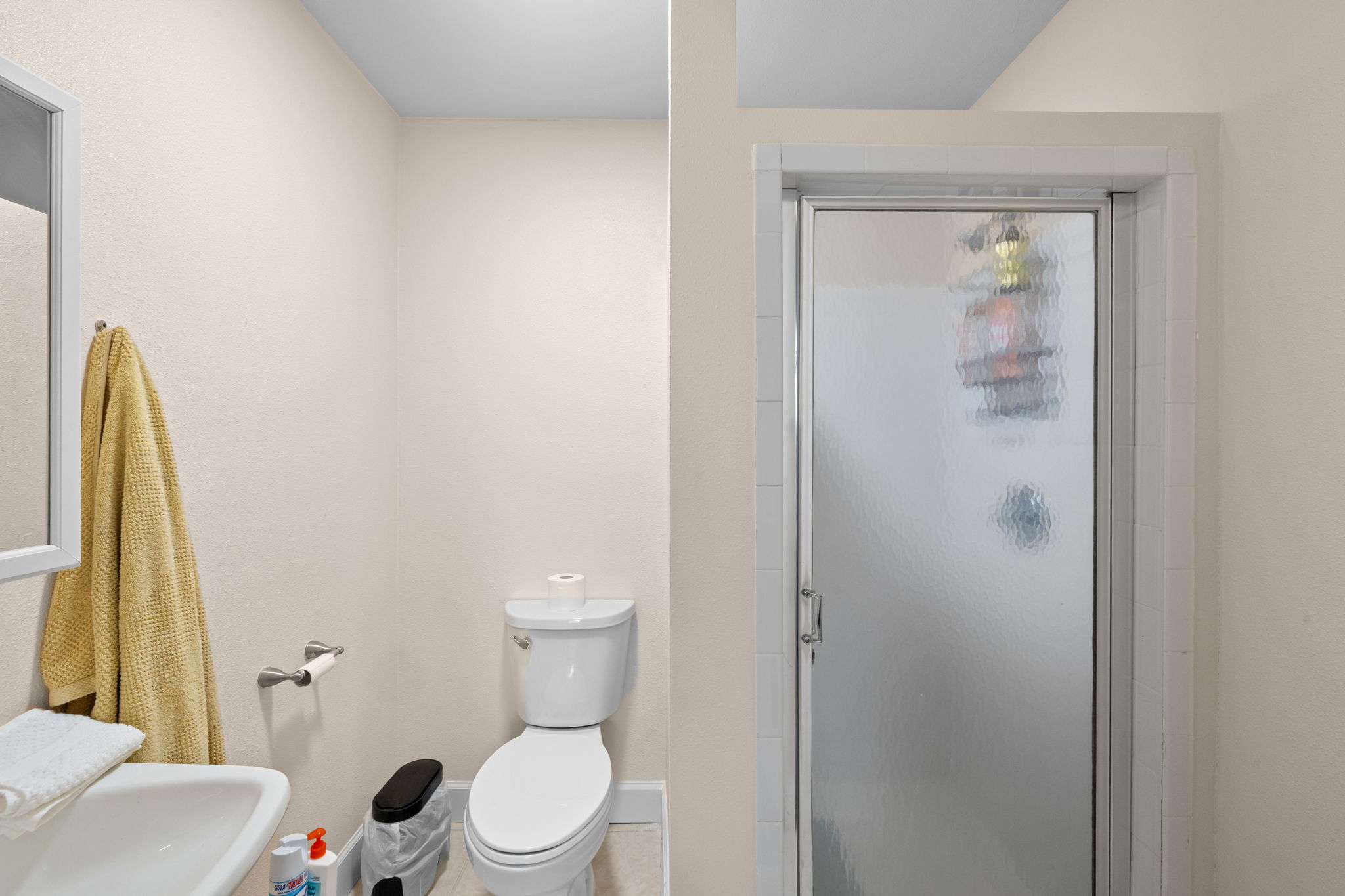 907 East 53rd Street Austin, TX 78751 - Photo 22 of 36 A compact bathroom featuring a sleek, frameless glass shower and a modern toilet, optimizing functionality.