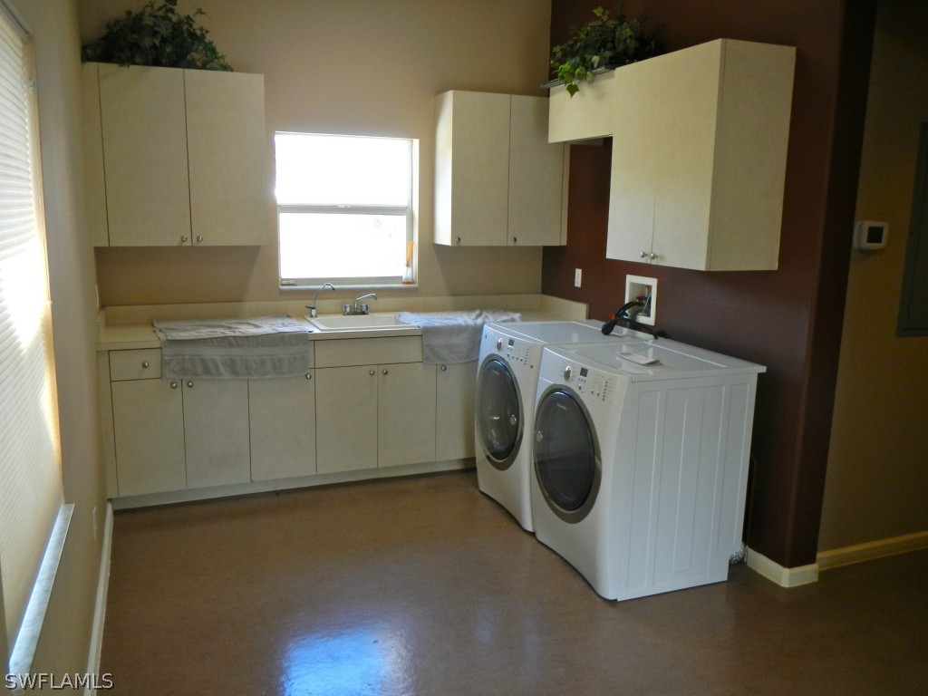 20150 North River Road Alva, FL 33920 - Photo 16 of 25 a utility room with sink dryer and washer