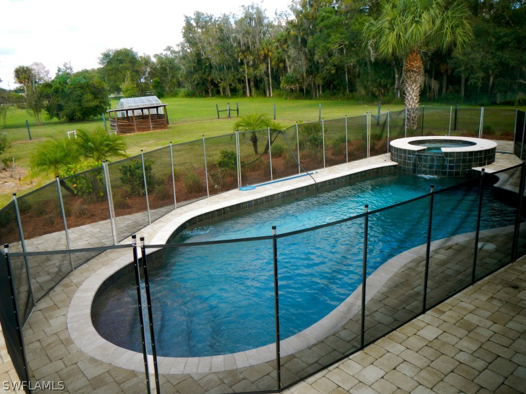 20150 North River Road Alva, FL 33920 - Photo 23 of 25 a view of a chairs and table in the patio