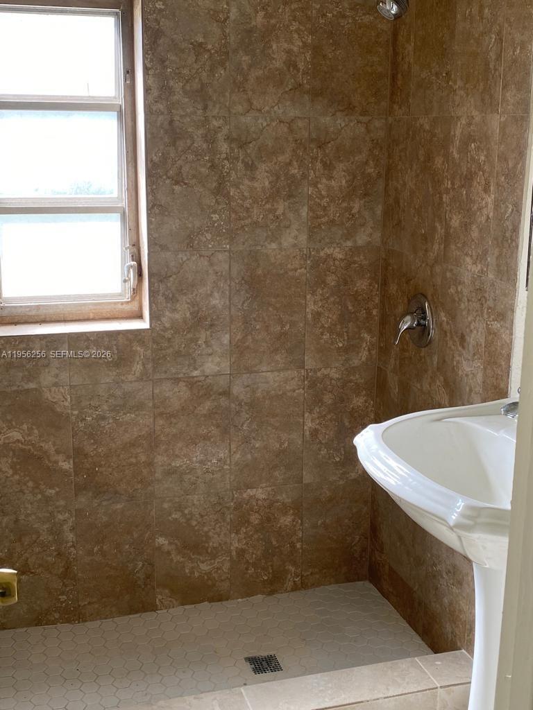 14680 Tyler Street Miami, FL 33176 - Photo 3 of 6 a bathroom with a bathtub