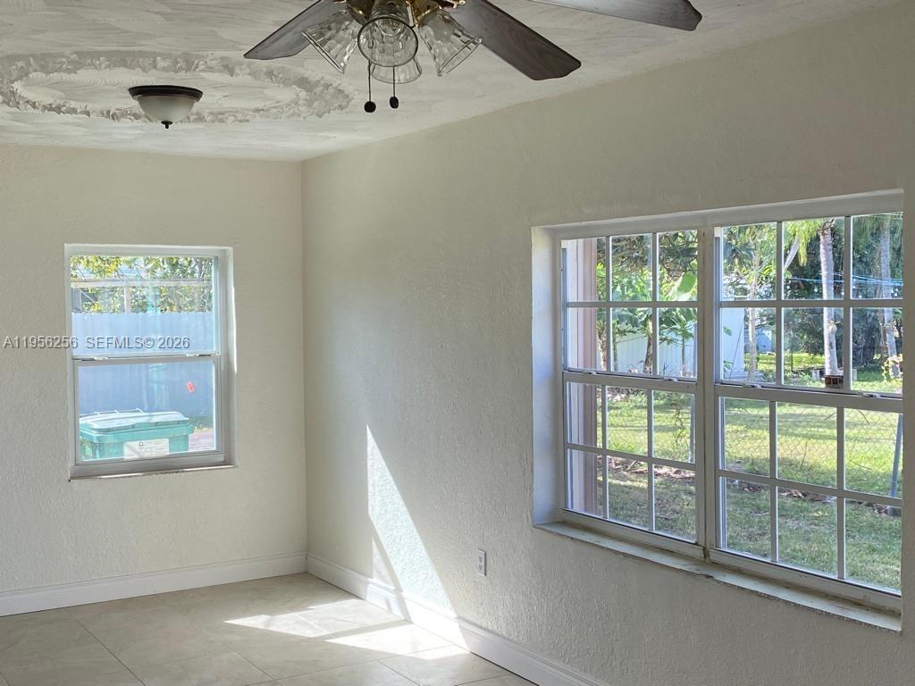 14680 Tyler Street Miami, FL 33176 - Photo 6 of 6 a view of an empty room with a window