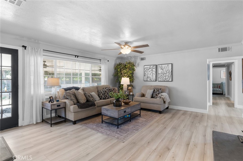 1005 North Encina Avenue Rialto, CA 92376 - Photo 13 of 39 a living room with furniture and a large window