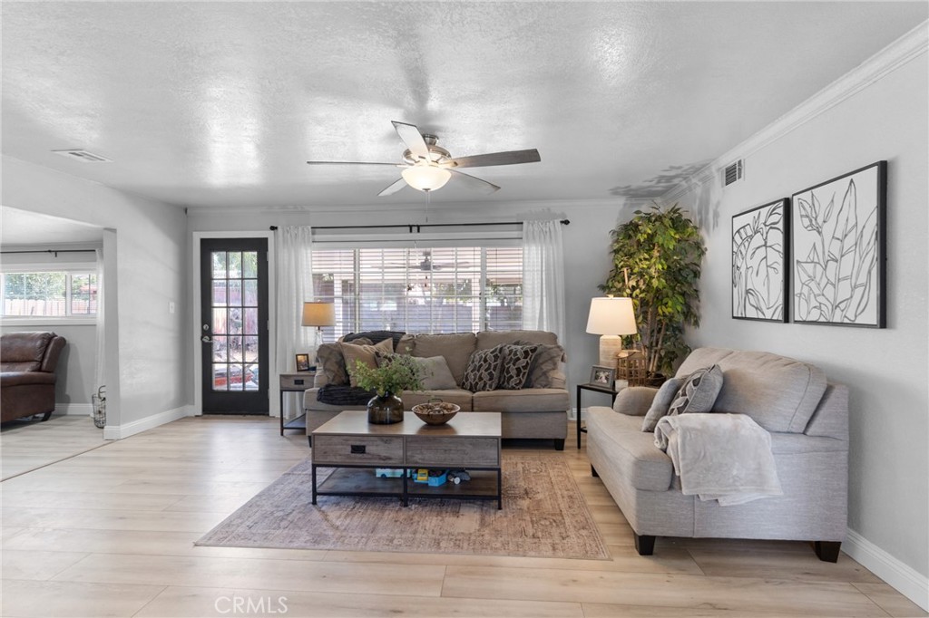 1005 North Encina Avenue Rialto, CA 92376 - Photo 14 of 39 a living room with furniture and a large window