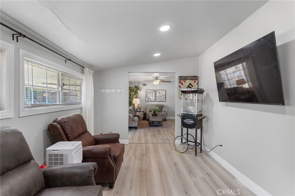 1005 North Encina Avenue Rialto, CA 92376 - Photo 18 of 39 a living room with furniture and a flat screen tv
