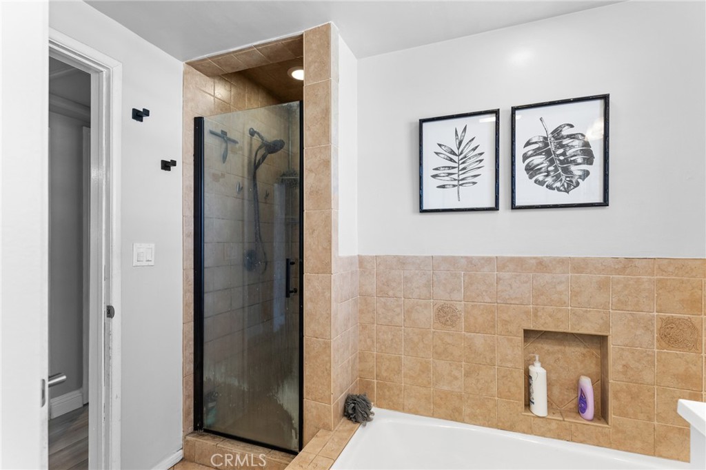 1005 North Encina Avenue Rialto, CA 92376 - Photo 24 of 39 a bathroom with a shower and a view of bathroom