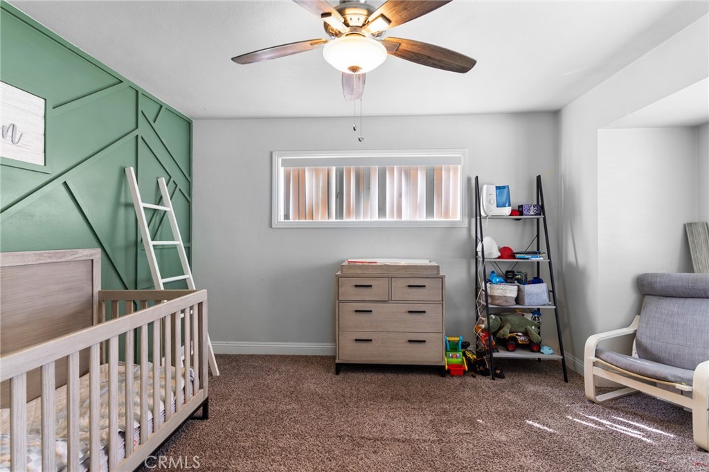 1005 North Encina Avenue Rialto, CA 92376 - Photo 26 of 39 a view of room with furniture and windows