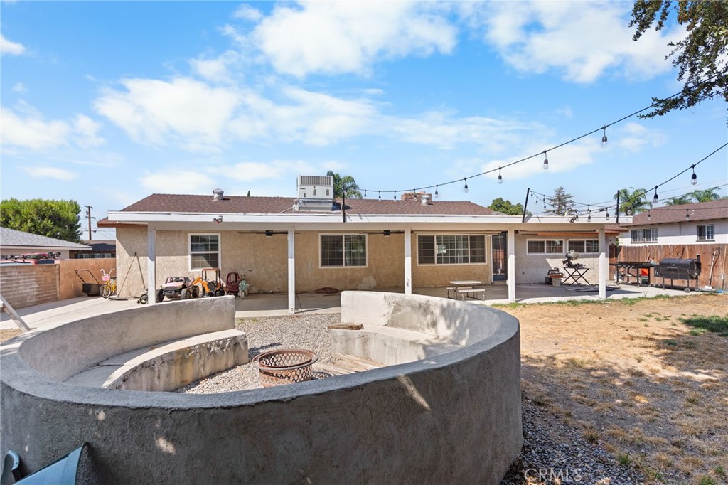 1005 North Encina Avenue Rialto, CA 92376 - Photo 35 of 39 a view of a house with swimming pool and sitting area