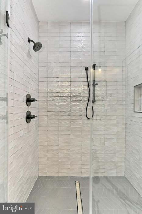 1313 Orren Street Northeast, Unit 3 Washington, DC 20002 - Photo 15 of 24 Sleek modern shower with elegant tiles.