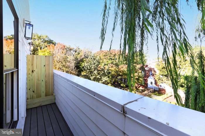 1313 Orren Street Northeast, Unit 3 Washington, DC 20002 - Photo 16 of 24 Serene balcony with lush greenery views.