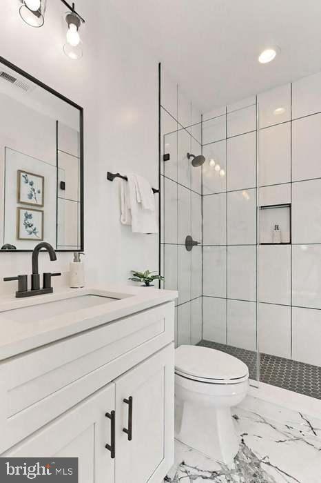 1313 Orren Street Northeast, Unit 3 Washington, DC 20002 - Photo 18 of 24 Sleek modern bathroom with elegant finishes.