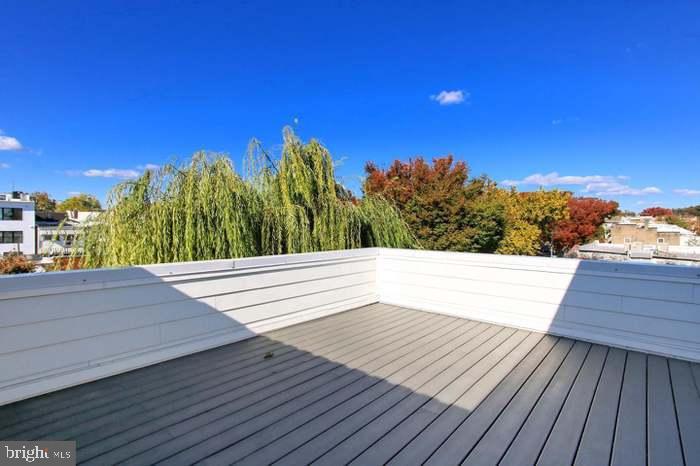 1313 Orren Street Northeast, Unit 3 Washington, DC 20002 - Photo 22 of 24 Sunny rooftop retreat with vibrant views.