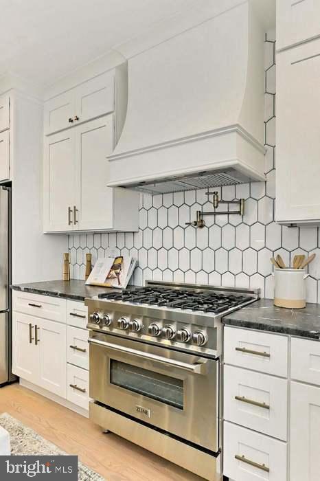 1313 Orren Street Northeast, Unit 3 Washington, DC 20002 - Photo 4 of 24 Sleek kitchen with modern hexagon tiles.