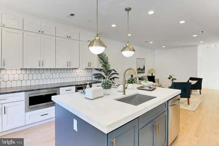 1313 Orren Street Northeast, Unit 3 Washington, DC 20002 - Photo 6 of 24 Modern kitchen with sleek design elements.