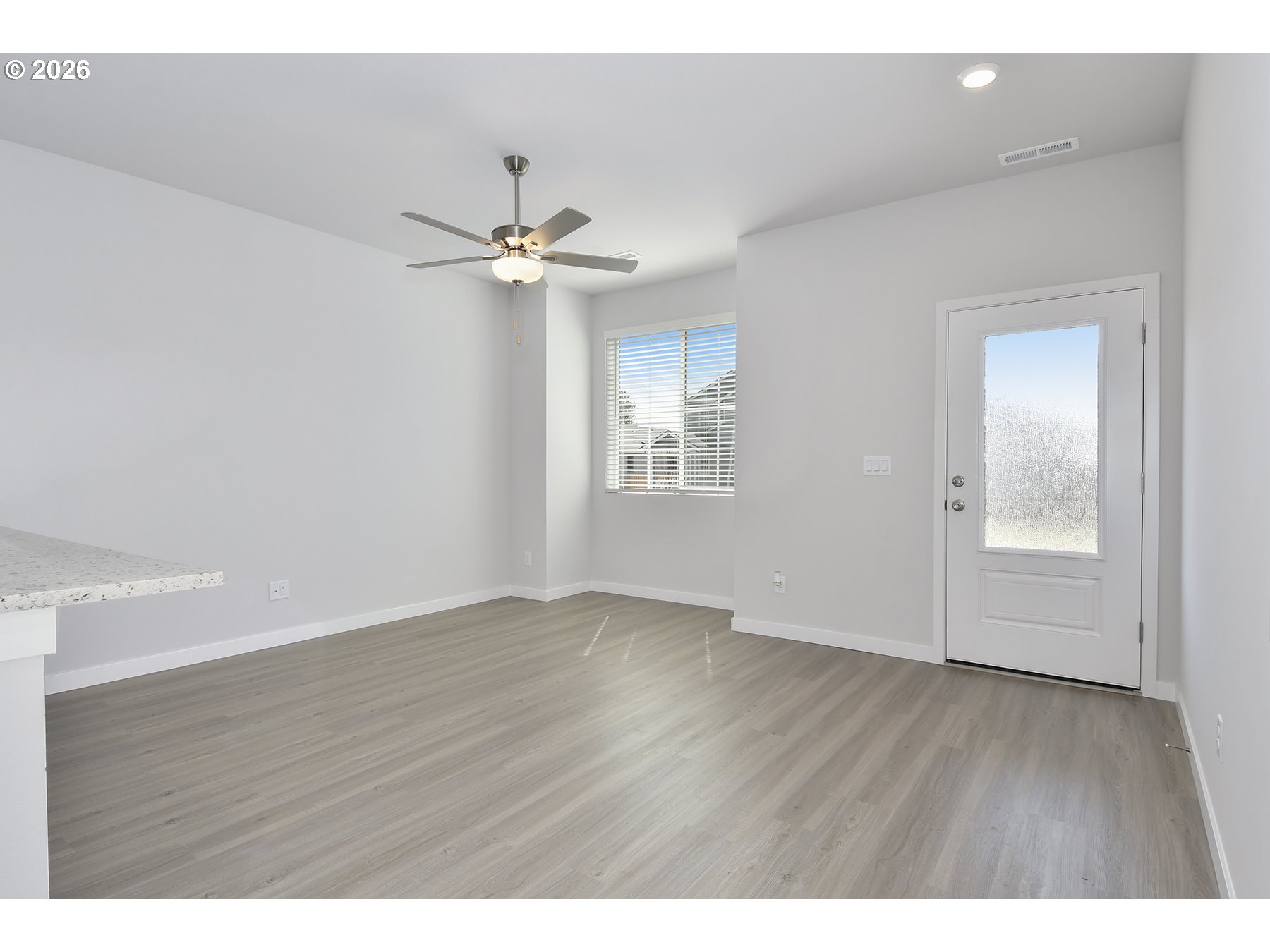 1175 Parkside Avenue Woodburn, OR 97071 - Photo 2 of 15 a view of an empty room with a window