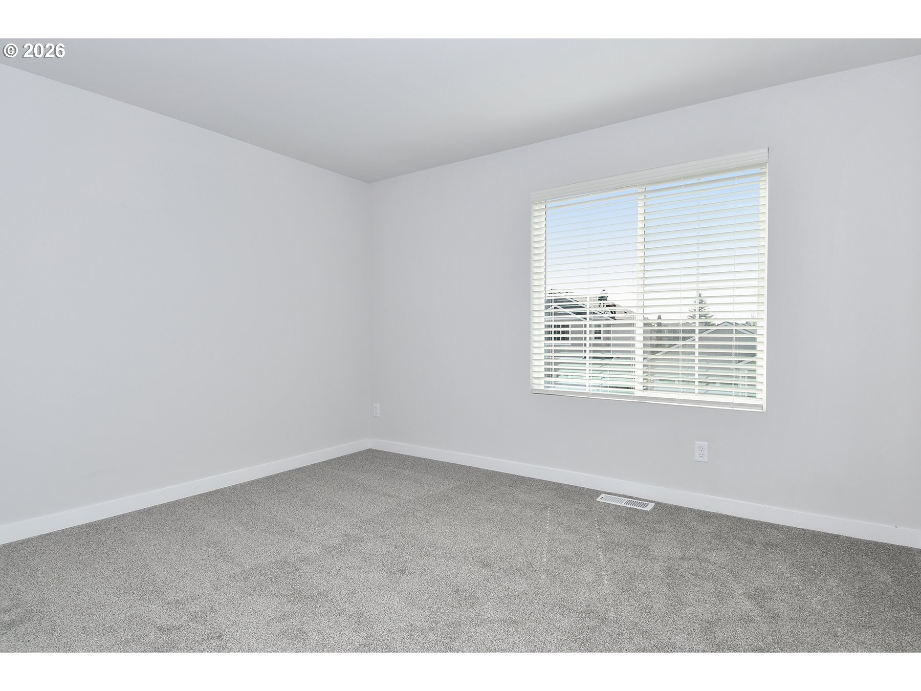 1175 Parkside Avenue Woodburn, OR 97071 - Photo 9 of 15 a view of an empty room with a window