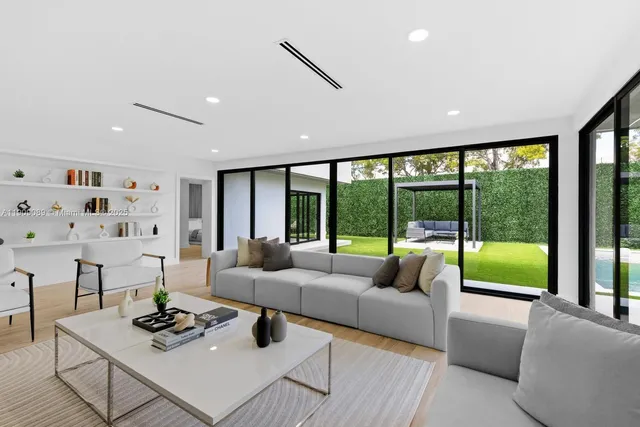 a living room with furniture and a large window