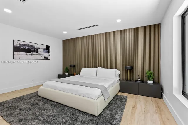 a bedroom with a large bed and a couch