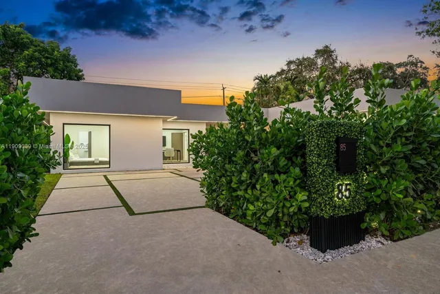 front view of a house with a yard
