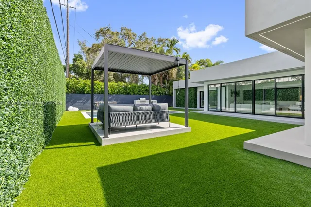 a view of a swimming pool with a patio