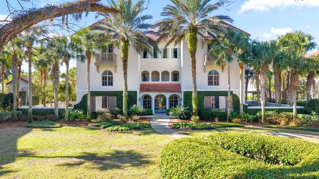 a front view of residential houses with yard and swimming pool