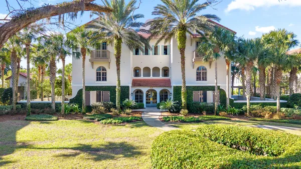 a front view of residential houses with yard and swimming pool