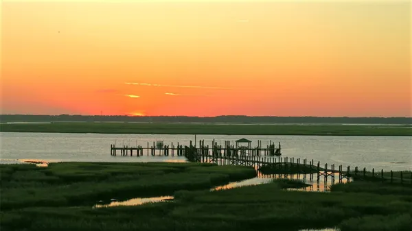 a view of a brick house with a yard