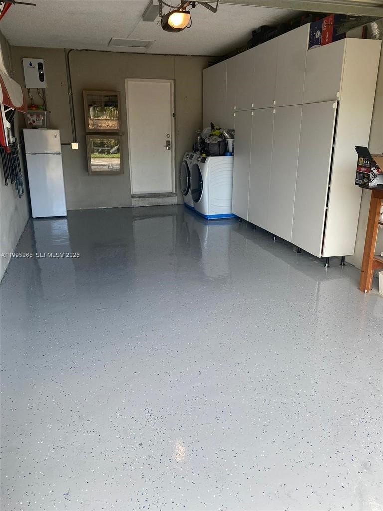 307 Bonnie Brae Way, Unit 26 Hollywood, FL 33021 - Photo 17 of 21 a view of a hallway with workspace and a window