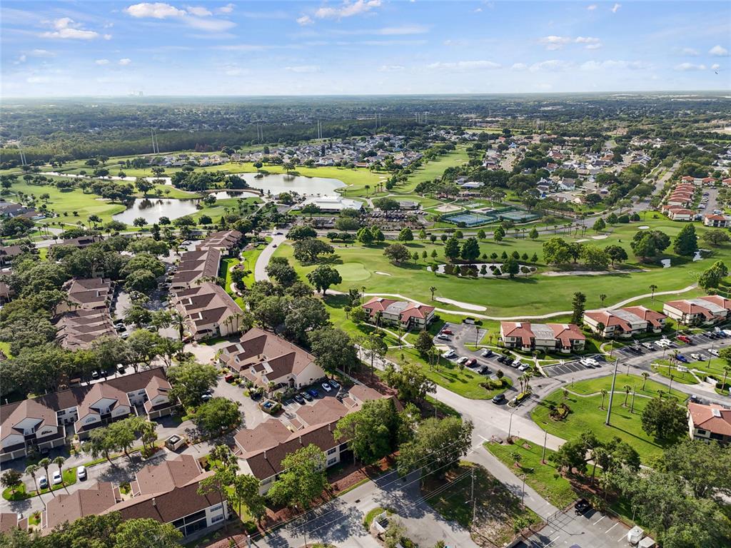 6029 Lake Pointe Drive, Unit 202 Orlando, FL 32822 - Photo 23 of 28 an aerial view of a houses with a lake view