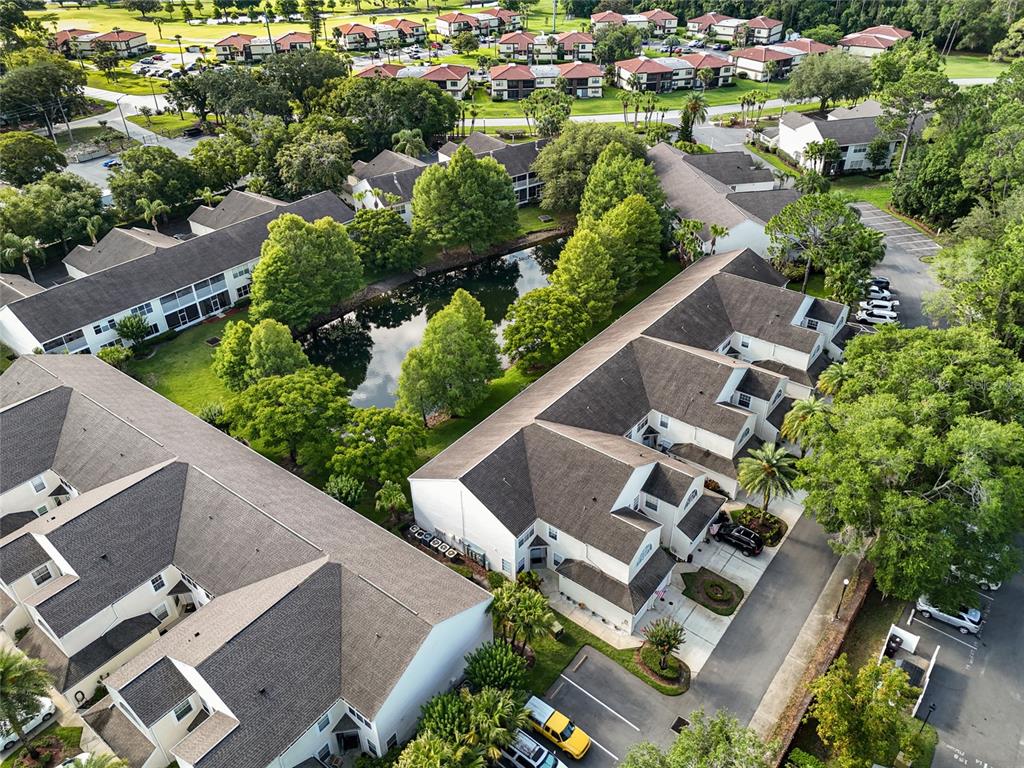 6029 Lake Pointe Drive, Unit 202 Orlando, FL 32822 - Photo 25 of 28 an aerial view of house with yard