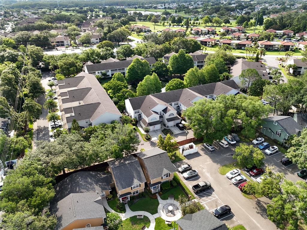 6029 Lake Pointe Drive, Unit 202 Orlando, FL 32822 - Photo 26 of 28 an aerial view of a house with a yard