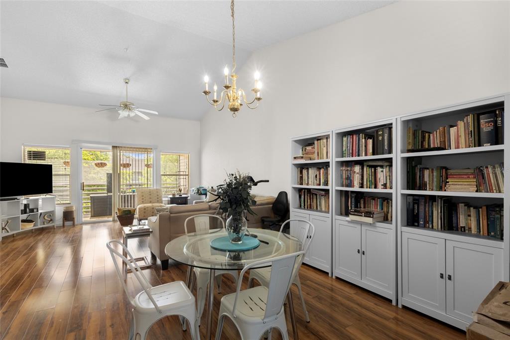 6029 Lake Pointe Drive, Unit 202 Orlando, FL 32822 - Photo 4 of 28 a view of a dining room with furniture window and wooden floor