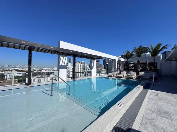 a view of swimming pool with chairs