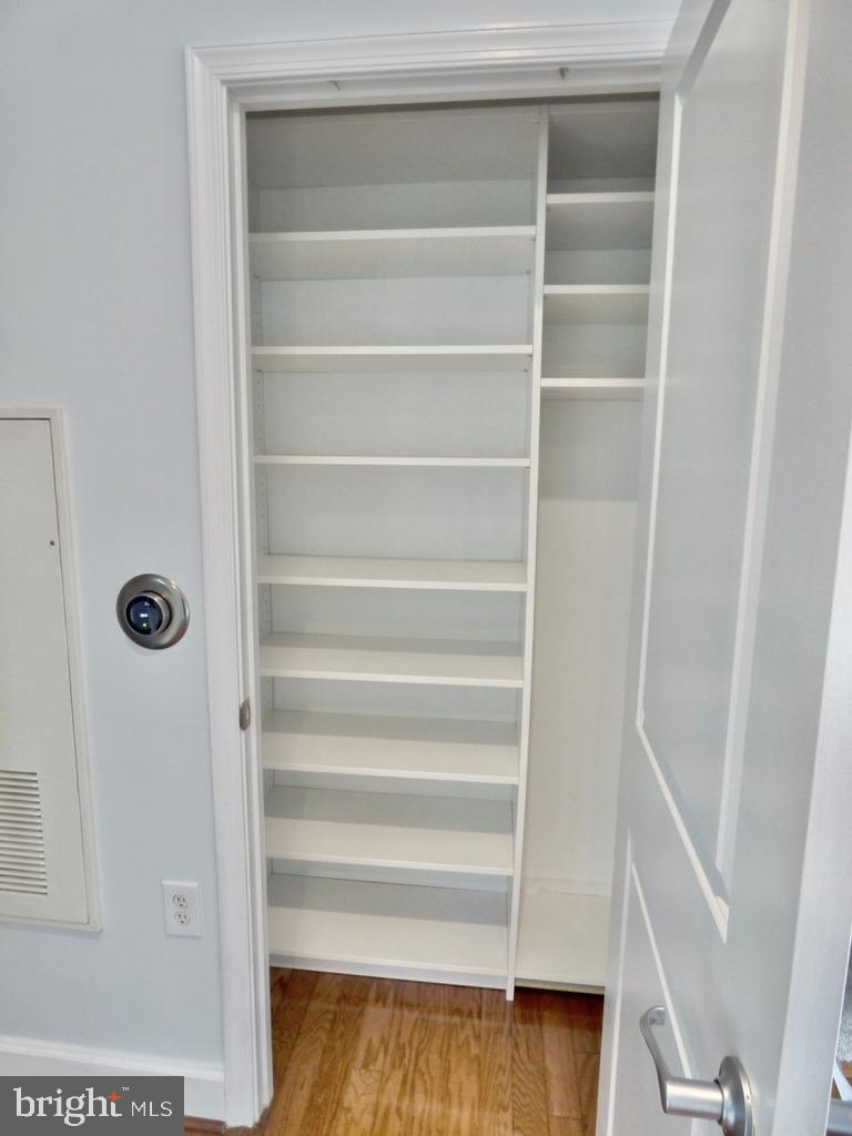 11800 Sunset Hills Road, Unit 118 Reston, VA 20190 - Photo 26 of 52 Spacious, organized closet awaits you.