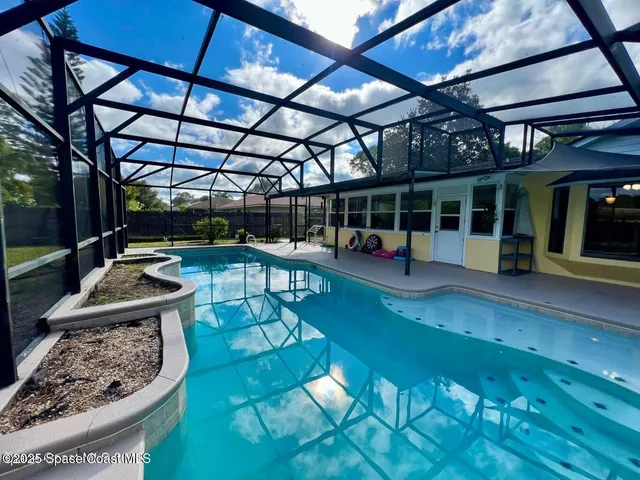 a view of a swimming pool with a patio