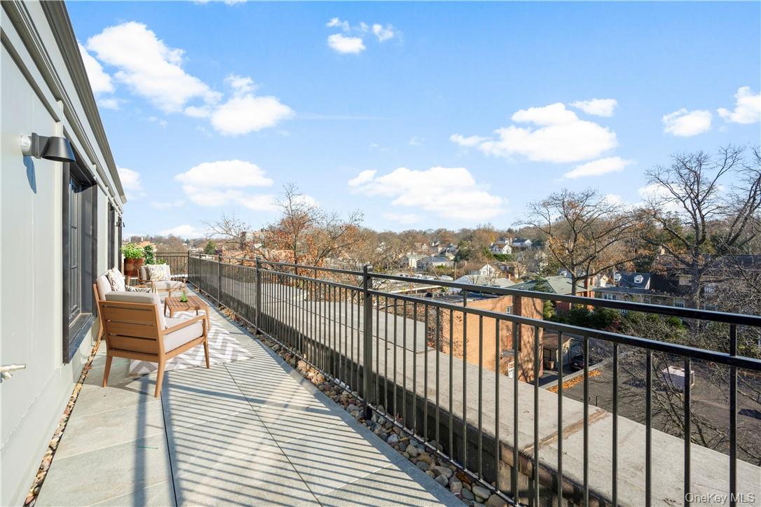 139 Fifth Avenue, Unit 5C Pelham, NY 10803 - Photo 11 of 32 a view of a city from a balcony
