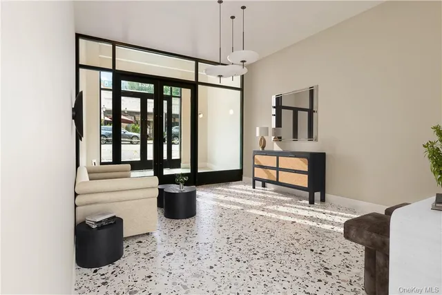 a living room with hardwood floor and furniture