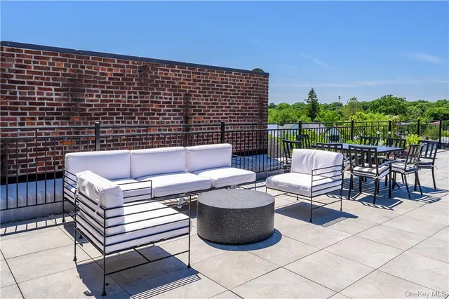 a view of a house with a yard and tree s
