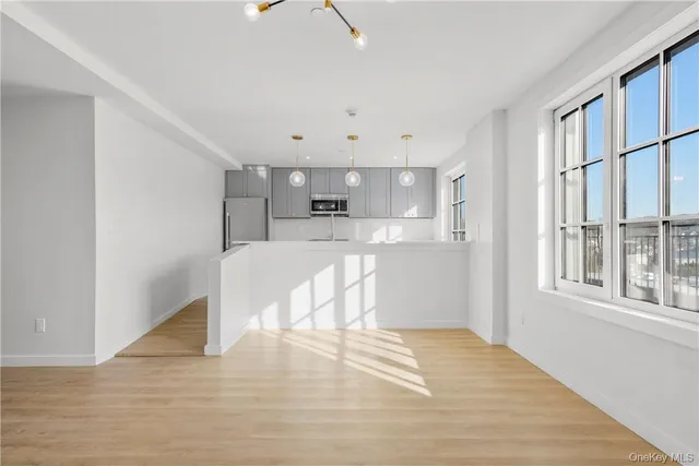 a view of kitchen and wooden floor