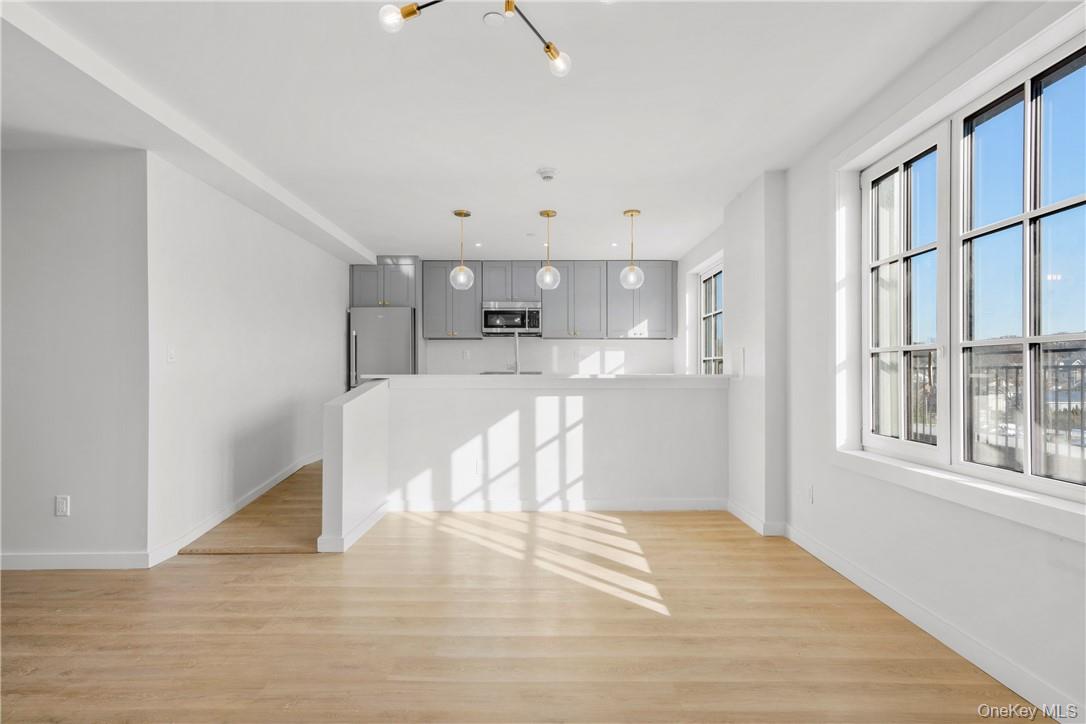 139 Fifth Avenue, Unit 5C Pelham, NY 10803 - Photo 5 of 32 a view of kitchen and wooden floor