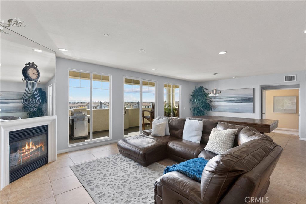 4240 Tradewinds Drive Oxnard, CA 93035 - Photo 12 of 43 a living room with furniture and a fireplace