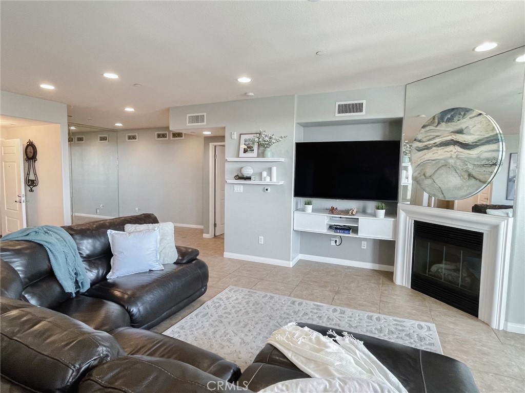 4240 Tradewinds Drive Oxnard, CA 93035 - Photo 17 of 43 a living room with furniture and a flat screen tv
